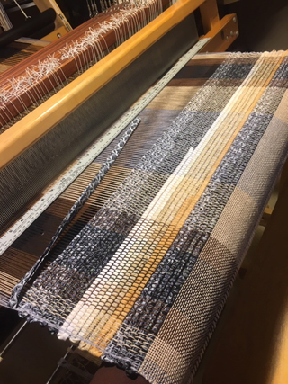 And Jacque wove a rug with 10 epi warp and 2" strips of quilting fabric sewn together at 45 degree angles to reduce bulges where strips are joined.