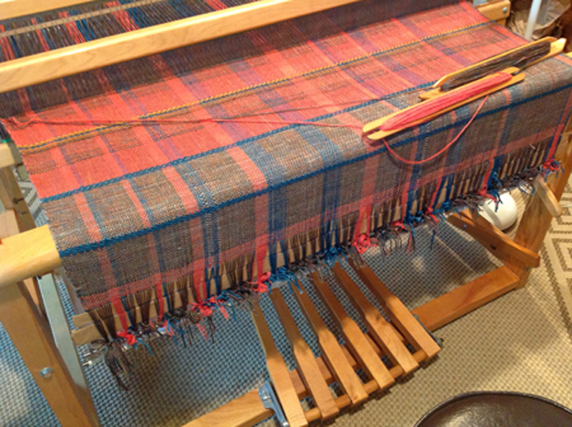 From Jeanne D.: Took some time to dress this ...unpattern....in the process of starting my three yards, my pawl broke so now progress is really slow….I'm on a waiting list for parts from leclerc. The yarns are wools and alpaca with some silk.