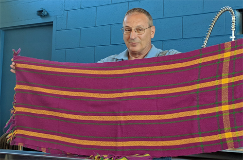 Tom wove this 3/2 cotton twill fabric on his rigid heddle loom. The fabric (11 feet long) will be made into a blouse.