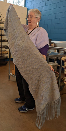 Harkening back to Margaret's challenge project, she brought another undulating twill shawl (tencel warp/silk weft). And she wove two more rugs and a sample for a stole for a friend's brother who is a priest.