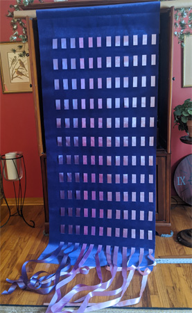 For her church, Lisa wove color-variegated ribbons into velvet yardage to create this wall hanging.