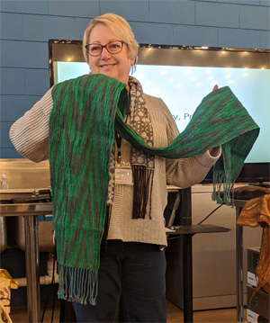 Ellen's three scarves were all woven on the same 20/2 teal cotton warp in Echo and Iris double weave patterns. The texture of the scarf on the left resulted from weaving with a colcolastic weft (lycra/20/2 cotton) which contracts when it's washed. The other two scarves had 20/2 silk wefts