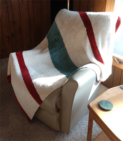 I only have one picture of a throw which is lovingly named He-Throw by my husband. My tiny dog thinks it's hers. It gained its name because Ken is over 6 feet tall and nothing fit him well, so this particular double weave chenille throw is 60 by 72. When he sits down he can even cover his feet! The rest of my stuff has been just fun projects to stretch my skills. Several totes in tubular double weave, a couple of smaller throws, and LOTS of towels just on different patterns to try new stuff. It was so great to hear from you again. Looking forward to the seminar!