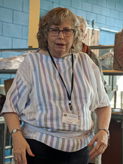 The cottolin fabric for Mary's top and her inkle weave belt were woven by Tom. She sewed the top using a Handwoven Collection 13 pattern.