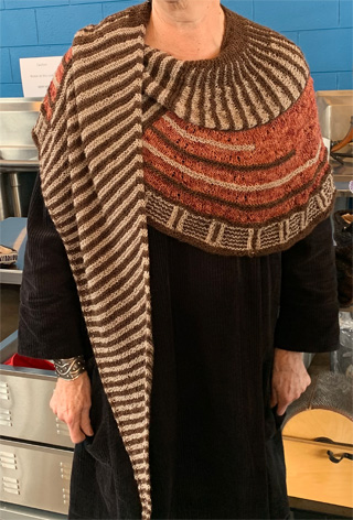 Shelby knit the shawl in the photo above with 30% silk:70% merino yarn.