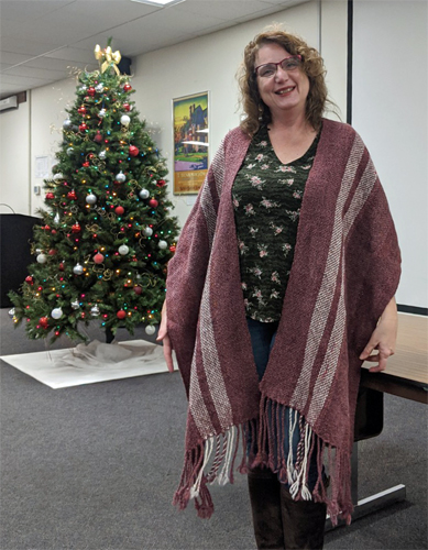 Lisa, with the Christmas tree in the background, showed us four pieces she had woven, including the alpaca shawl on the left and the llama scarf on the right. Both were woven at 6 epi.
