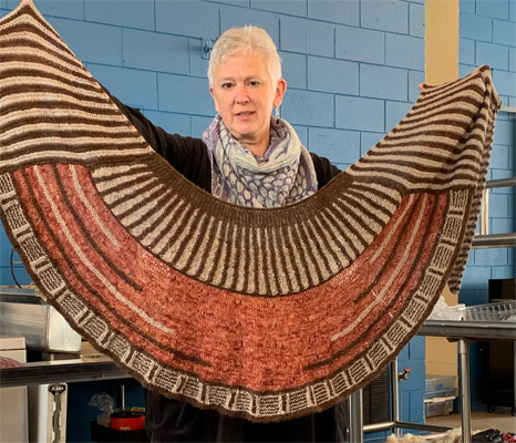 Shelby knit the shawl in the photo above with 30% silk:70% merino yarn.