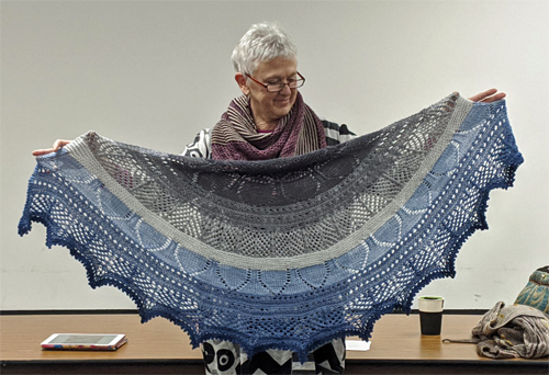 Shelby brought two wool shawls she had knit -- on the left in a striped pattern, on the right in a variety of lace stitches.