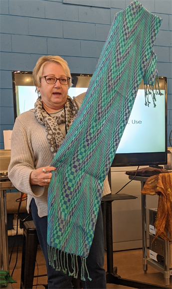 Ellen's three scarves were all woven on the same 20/2 teal cotton warp in Echo and Iris double weave patterns. The texture of the scarf on the left resulted from weaving with a colcolastic weft (lycra/20/2 cotton) which contracts when it's washed. The other two scarves had 20/2 silk wefts