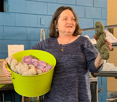 Terry brought a bin of skeins she had spun as well as examples of batts with colorful locks she had prepared.