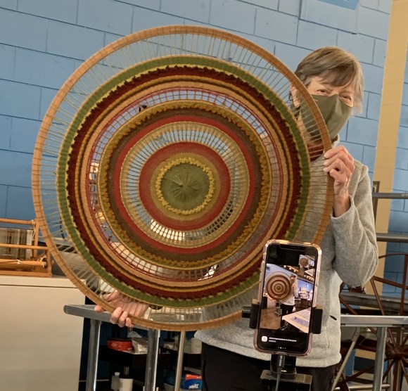 A large round weaving in autumn colors